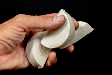 Surf board wax, blocks of surf wax, white round wax, black background.