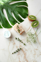 Natural cosmetics with ingredients on table