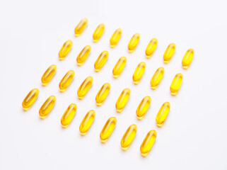 Fish oil capsules on white background