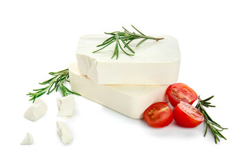 Tasty feta cheese with herbs and tomato on white background