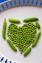 Green fresh peas isolated on white top view.