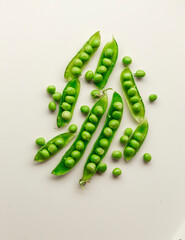 Green fresh peas isolated on white top view.