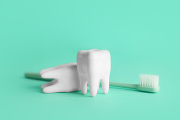 Fototapeta na wymiar Teeth with toothbrush on color background