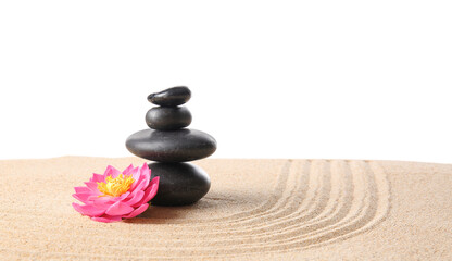 Fototapeta na wymiar Stones and flower on sand against white background. Zen concept