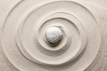Stone on sand with lines. Zen concept