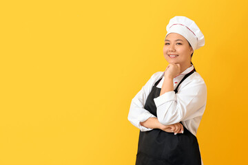 Beautiful Asian chef on color background