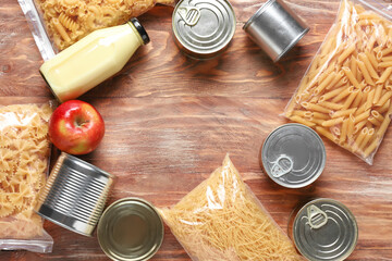 Different products on wooden background. Donation concept