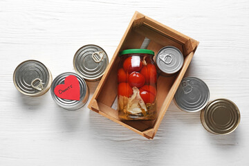Donation box with products on white background