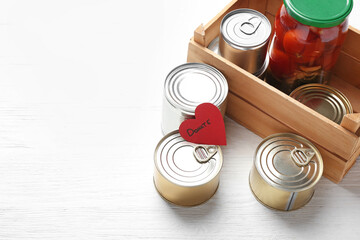 Donation box with products on white background