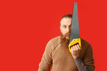 Handsome lumberjack on color background