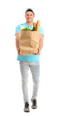 Delivery man with food in bag on white background