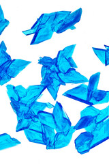 Beautiful crystals of Copper Sulphate shown in close-up and isolated against a white background. Copper Sulfate is used in industry, agriculture and medicine and is commonly used in school science. 