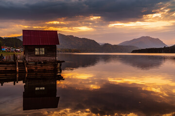 Lake wharf with a wooden pier at dawn. Teletskoye Lake, Artybash Village, Altai Republic, Russia