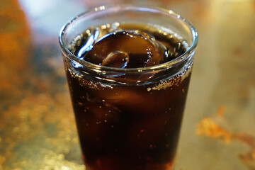 Close up glass of iced black Americano coffee on marbled table