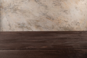 Image of wooden table in front of blurred background. Empty wooden table platform over background for present product.
