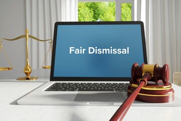 Fair Dismissal – law, jurisdiction. A lawyer laptop in the office on desk. Text on the screen. Libra and hammer