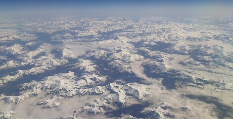 Aerial view of snowy mountains from an airplane