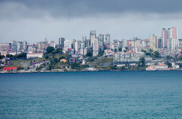 Fototapeta na wymiar Salvador, Brazil, a view of the city from the sea. Salvador is a port city located in the North-East of Brazil on a small Peninsula almost triangular in shape. It is the administrative center of the 