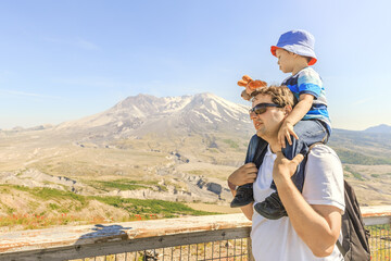 Father and son with Mt. St. Helens in a background