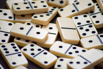 Closeup of a set of scattered domino pieces.