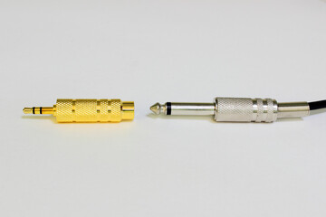 Audio adapter from TS or tip sleeve 6.5 mm jack to TRS or tip ring sleeve 3.5 mm jack. From stereo...