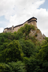Fototapeta na wymiar Orava Castle on a high rock above Orava river in the village of Oravsky Podzamok in Slovakia