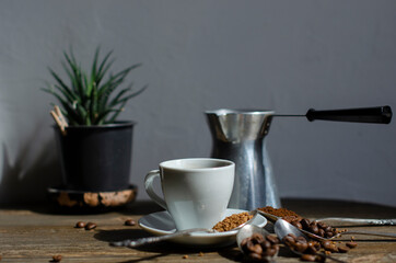 a cup of coffee on the table with different types of kefe in spoons