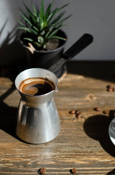 a cup of coffee on the table with different types of kefe in spoons
