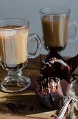 chocolate muffins on the table with a cup of coffee