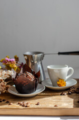 chocolate muffins on the table with a cup of coffee