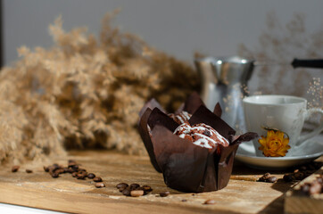 chocolate muffins on the table with a cup of coffee