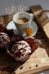 cup of coffee on the table with cupcakes