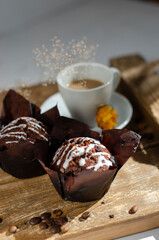 cup of coffee on the table with cupcakes