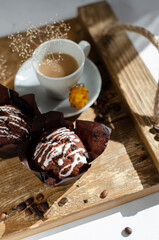 cup of coffee on the table with cupcakes