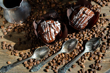 chocolate cupcake with sprinkled coffee beans on the table