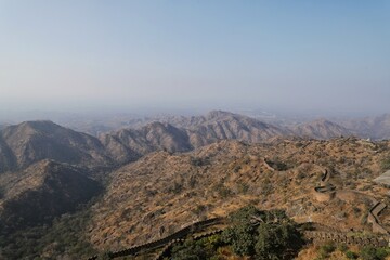 Fototapeta na wymiar Rajasthan Kumbhalgarh- beautiful view of aravali mountain from the fort with the world's second longest wall.