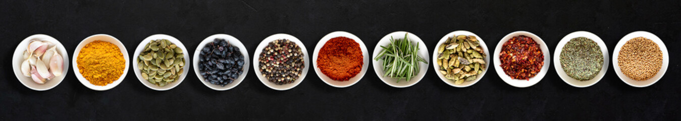 pattern with spices for cooking - pepper, cinnamon, turmeric, bay leaf, herbs