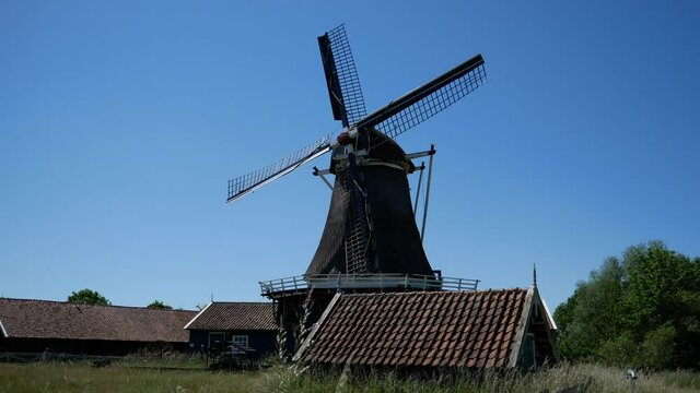 This old antique Dutch windmill (1863)  is a prime example of windmill power, providing renewable clean wind power energy.