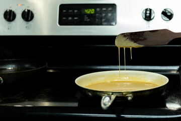 Homemade caramel cooking Process in frying pan.