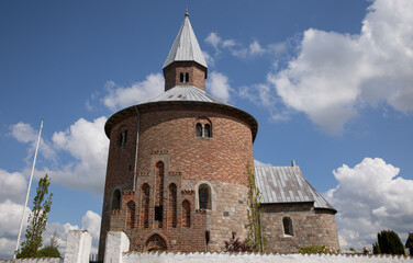 Fototapeta na wymiar Round church with blue sky and clouds