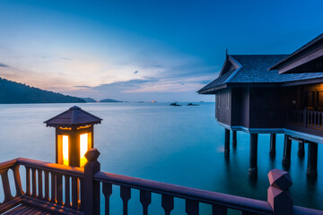 Peaceful and quiet view of the ocean with wooden houses on stilts at the Straits of Malacca 