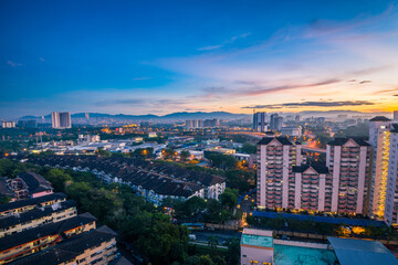 Fototapeta na wymiar Peaceful and quiet sunrise with view of the city skyline of Kuala Lumpur