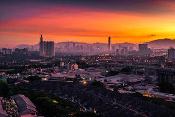 Panorama sunset Kuala Lumpur city skyline view with orange sky, Malaysia