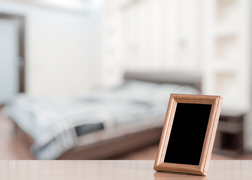 photo frame on the wooden table