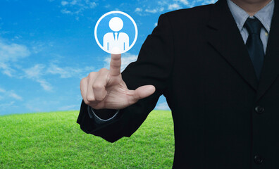 Hand click businessman flat icon over green grass field with blue sky, Business communication...