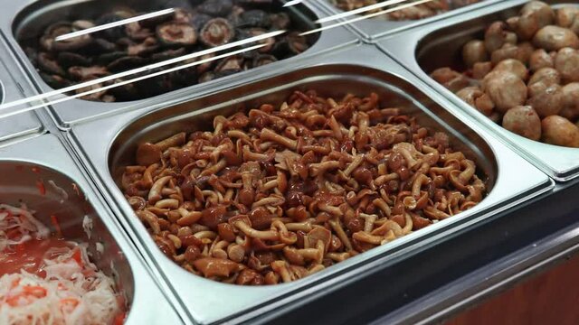 honey agaric pickled mushrooms on the shelves of a hypermarket, Korean cuisine market