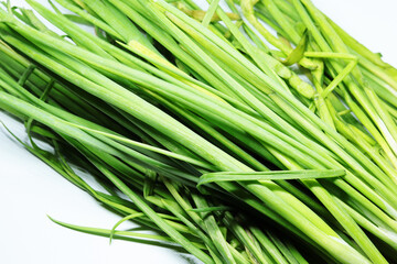 Fresh Green Spring Onion With Roots On An Isolated White Background