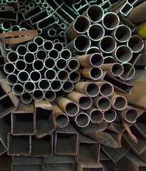 Steel pipe material stack storage background. They used from structural works in various factories or industries, premium photos. For recycling, for devils engineers