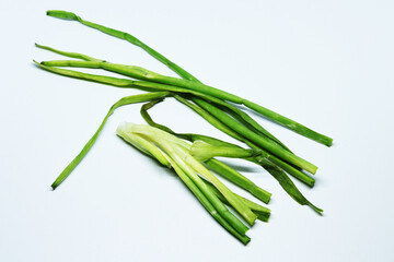 Fresh Green Spring Onion With Roots On An Isolated White Background
