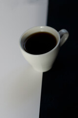 cup of coffee on double black and white background